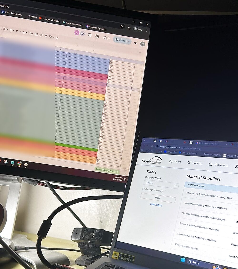 A supplier contact sheet on the monitor and the SkyeVantage CRM's Material Suppliers list on the laptop, with email addresses blurred